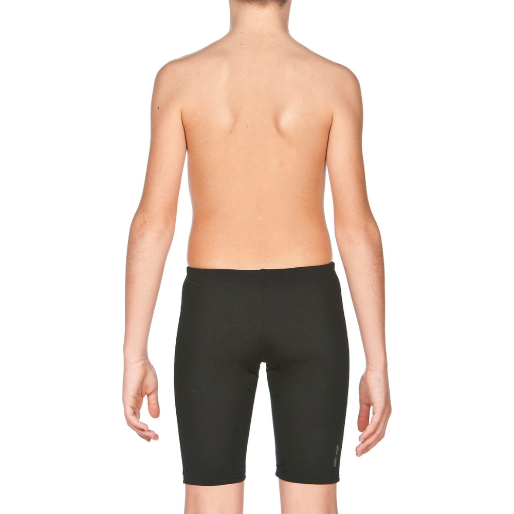 a young boy wearing a pair of black shorts
