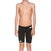 a young boy with no shirt wearing a pair of shorts