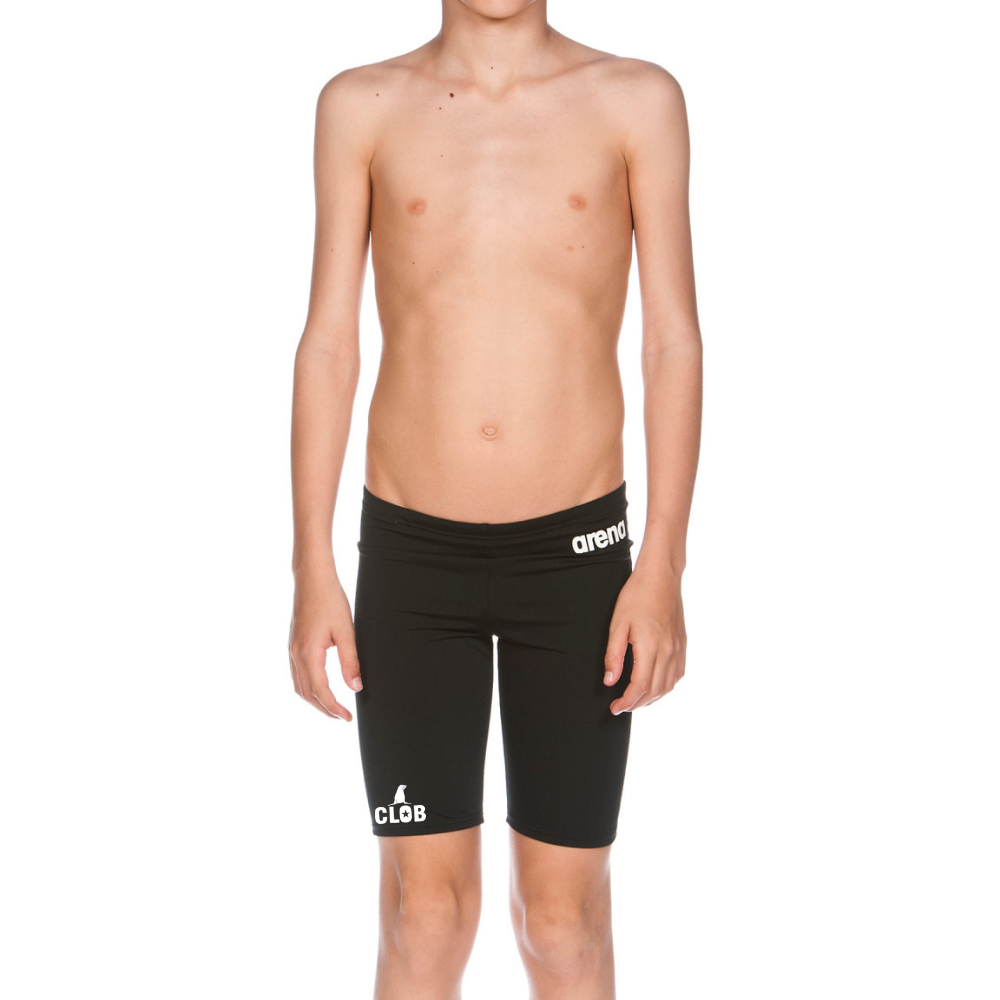 a young boy with no shirt wearing a pair of shorts